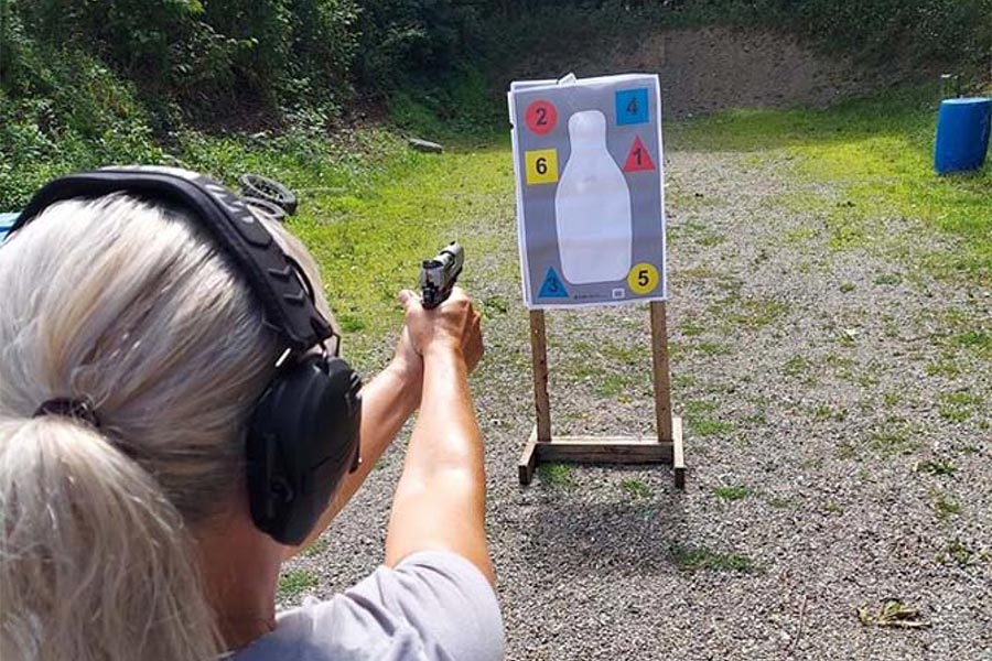 woman aiming at target practice